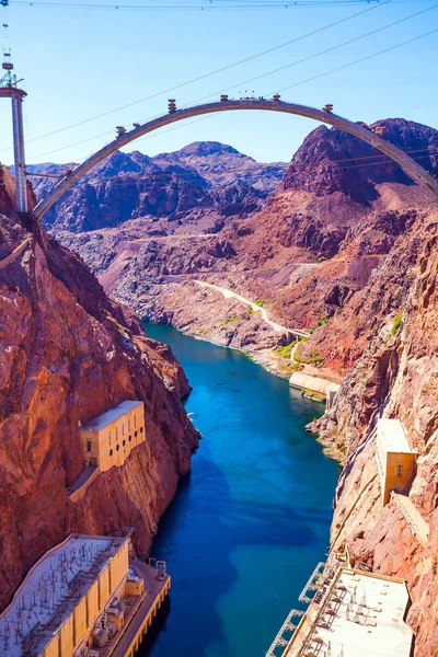 USA. The lower course of the Colorado River. The construction of the longest concrete arch bridge in 2009. Grandiose engineering decision. The concept of active and photo tourism