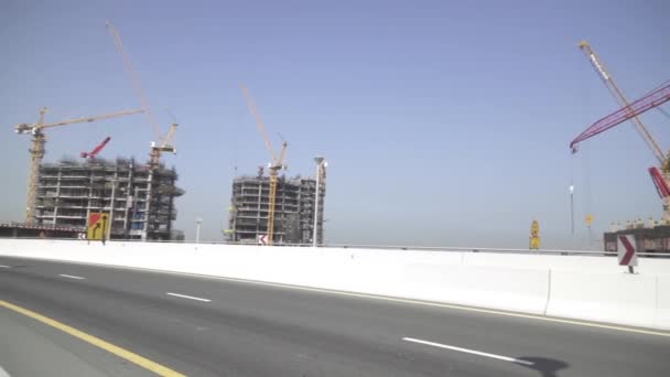 Construction of new buildings in the area of Dubai Marina stock footage video — Stock Video