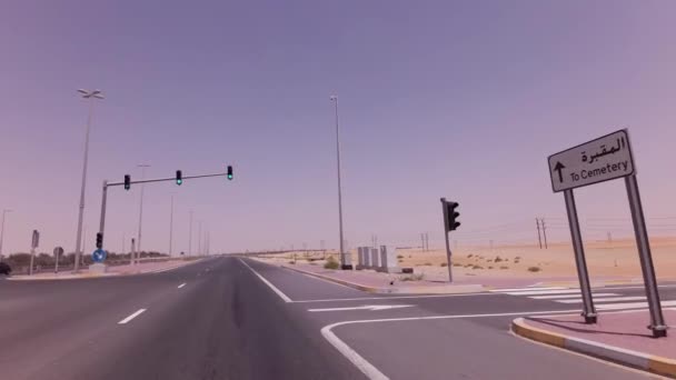 Four-way intersection with traffic lights on the highway in desert stock footage video — Stock Video