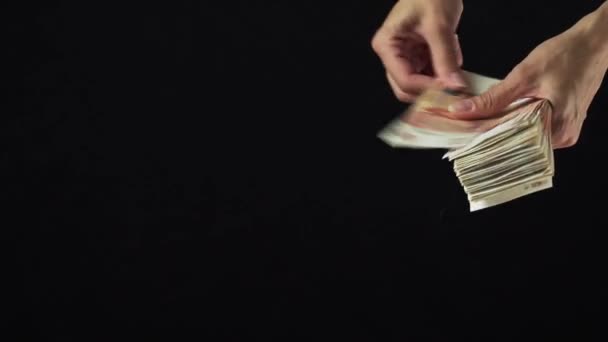 Female hand scatter five thousand rubles banknotes on black background slow motion stock footage video — Stock Video