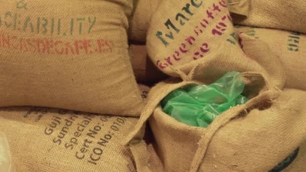 Bags of coffee beans in the roasting workshop on coffee background stock footage video — Stock Video