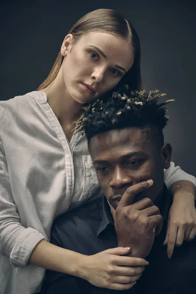 romantic couple - boyfriend and girlfriend against dark background