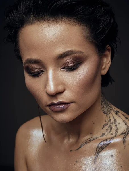 Woman with tattoo beauty studio portrait — Stock Photo, Image