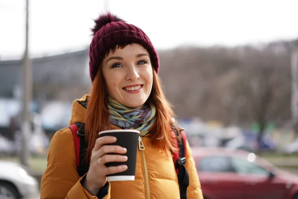 Woman on a street with cup of tea — Stock Photo, Image