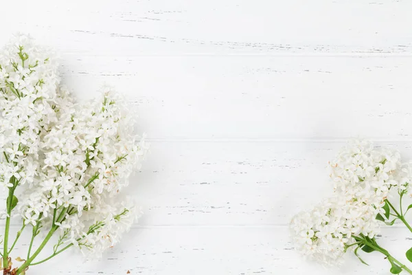 White lilac flowers over wooden background. Top view with space for your text — Stock Image White Lilac Flowers Wooden Background Top View Space Your Text Stock Picture