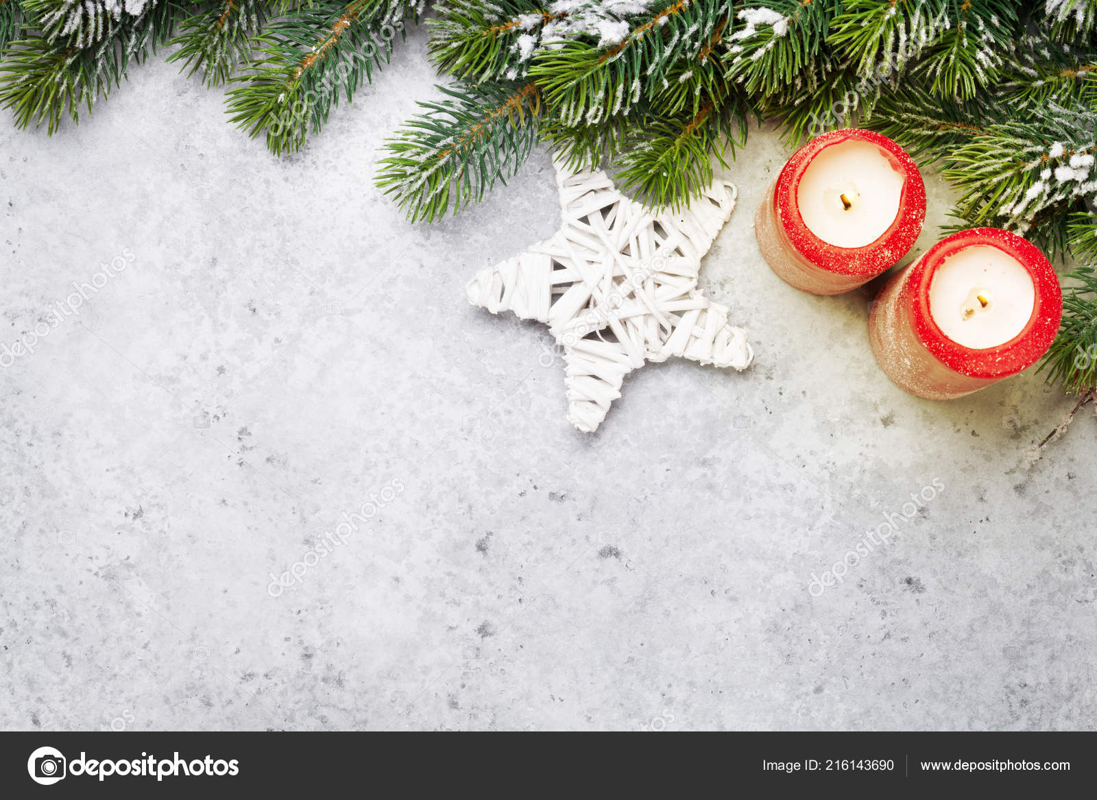 Christmas decor candles and fir tree branch covered by snow on stone background Top view xmas backdrop with space for your greetings — Fotografie od