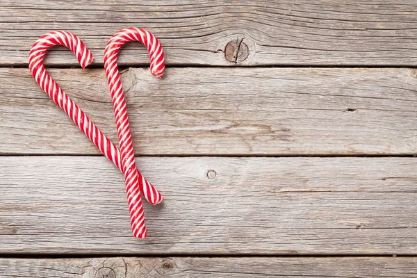 Kerst Candy Canes Houten Tafel Bovenaanzicht Met Ruimte Voor Groeten — Stockfoto