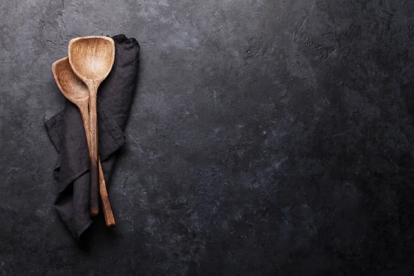 Cooking Wooden Utensils Black Towel Stone Kitchen Table — Stock Photo, Image