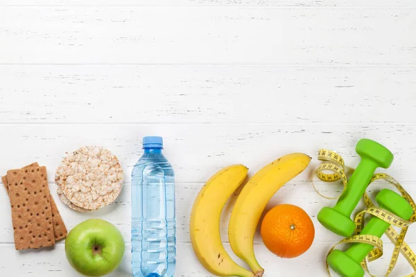 Dumbbells Fruits Drink Bottle White Wooden Table — Stock Photo, Image