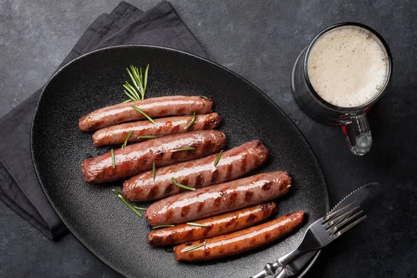 Grilled sausages and beer — Stock Photo, Image