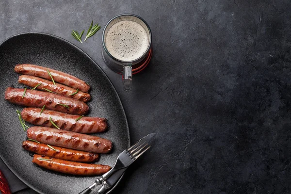 Grilled sausages and beer — Stock Photo, Image