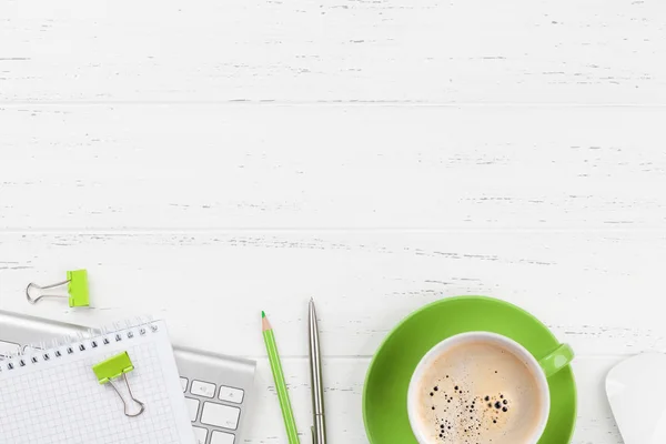 Office workplace table with coffee, supplies and computer — Stock Photo, Image