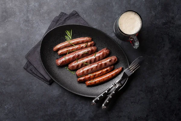 Grilled sausages and beer — Stock Photo, Image