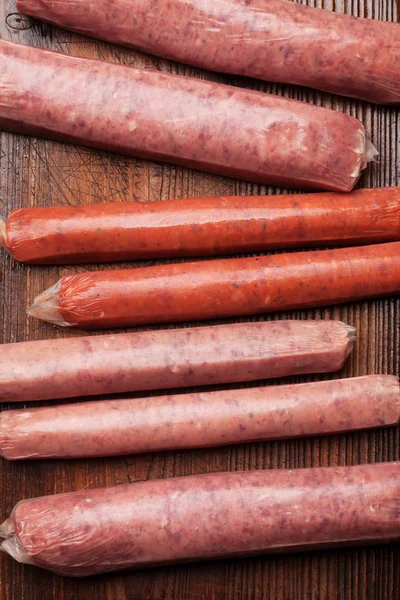 Raw sausages cooking — Stock Photo, Image