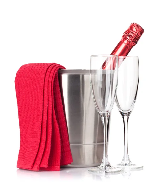 Champagne bottle in ice bucket and glasses — Stock Photo, Image