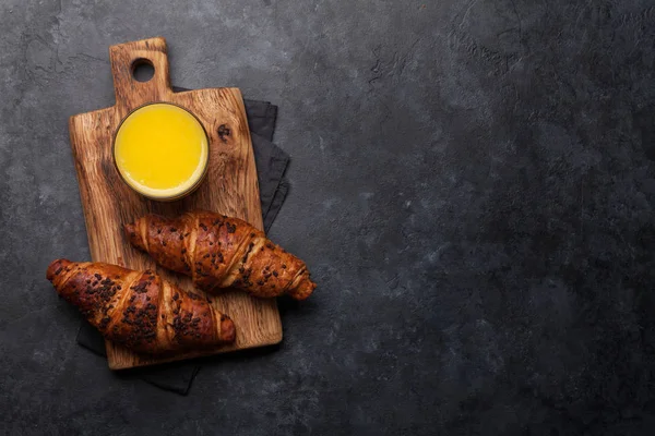 Orange juice and croissant — Stock Photo, Image