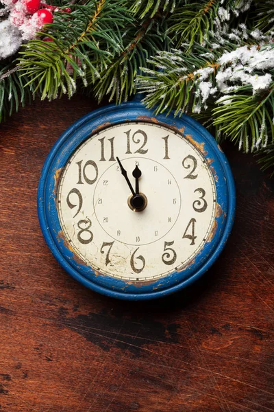 Christmas fir tree and alarm clock over old wood — ストック写真