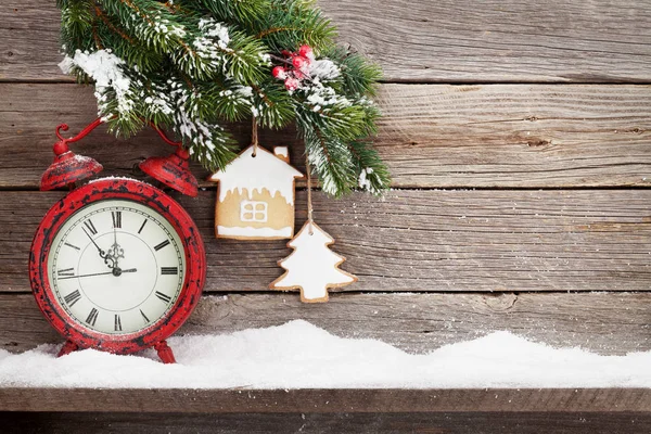 Christmas alarm clock and fir tree branch — Stock Photo, Image