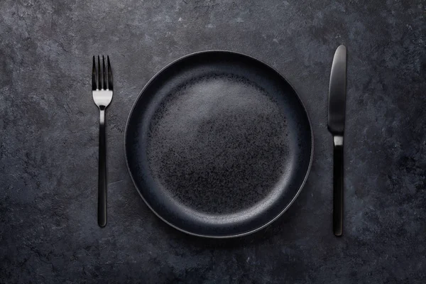 Empty plate, fork and knife — Stock Photo, Image