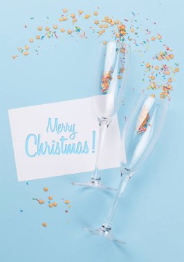 Champagne glasses and colorful sweets holiday