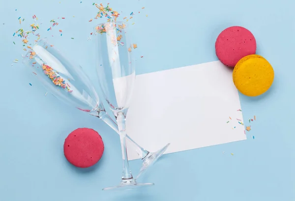Champagne glasses and colorful sweets holiday — ストック写真