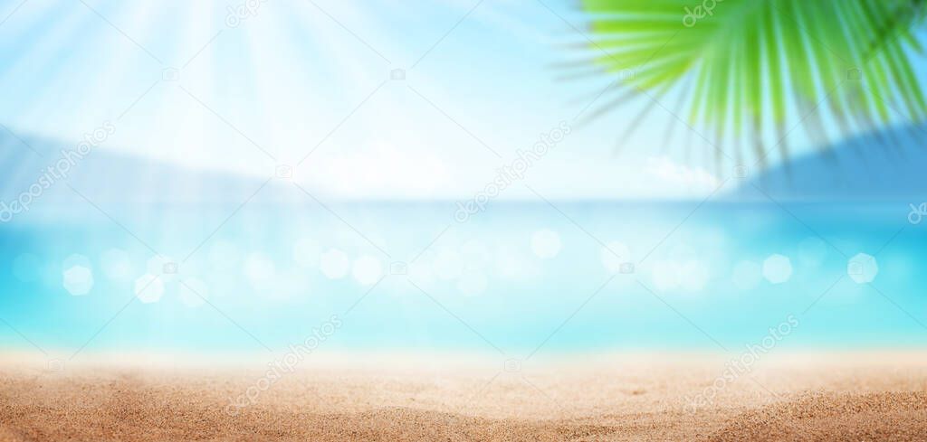 Summer tropical sea with sparkling waves, sunny sky and hot sand beach. Travel and vacation concept with copy space