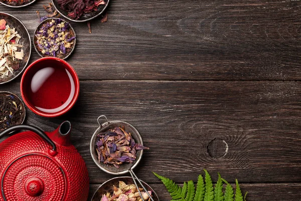 Various Herbal Dry Tea Teapot Cup Wooden Table Top View — Stock Photo, Image