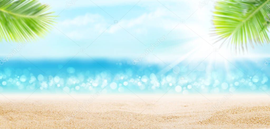 Summer tropical sea with sparkling waves, hot sand on the beach and blue sunny sky. Wide template background