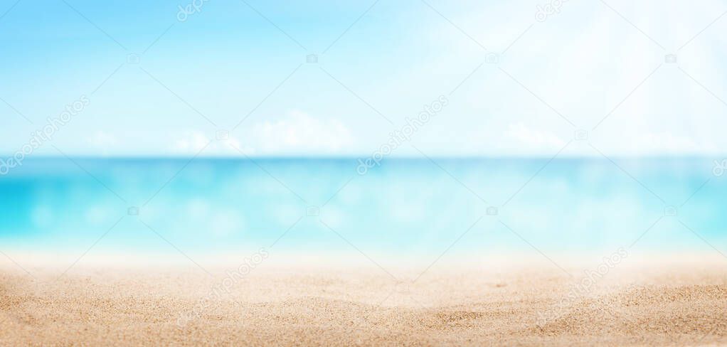 Summer tropical sea with sparkling waves, hot sand on the beach and blue sunny sky. Wide template background