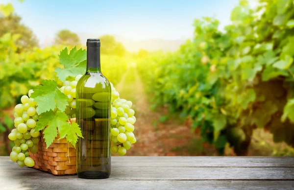 White Grapes Basket White Wine Bottle Wooden Table Front Landscape — Stock Photo, Image