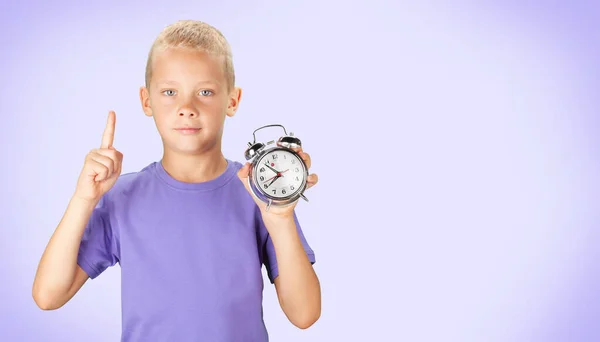 School Boy Showing Alarm Clock Color Background — Stock Photo, Image