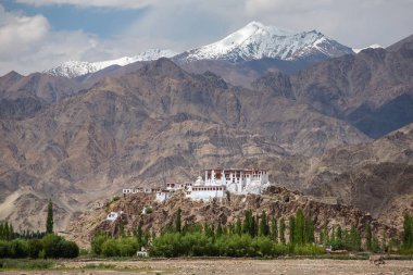 Stakna gompa temple ( buddhist monastery ) with a view of Himalaya mountains in Leh, Ladakh, Jammu and Kashmir, India. clipart