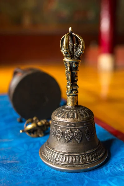 Buddhist religious equipment. Vajra Dorje and bell. Closeup view in Tibetan Buddhist monastery in Ladakh