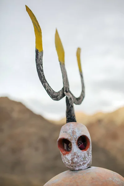 Tantric trident and skull, sits on top of the Likir monastery. The trident is one of the most important symbolic weapons of tantric deities in their fight against the enemies of Buddhism.