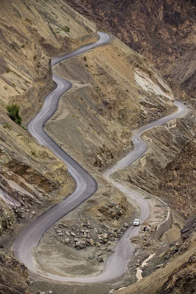 Sharp curve on mountain road in Himalaya mountains, Ladakh region, India