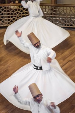 Semazen or Whirling Dervishes at Mevlana Culture Center in Konya, Turkey clipart