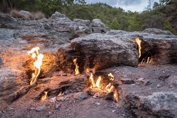Flames of Chimera Mount from the underground in Cirali, Turkey