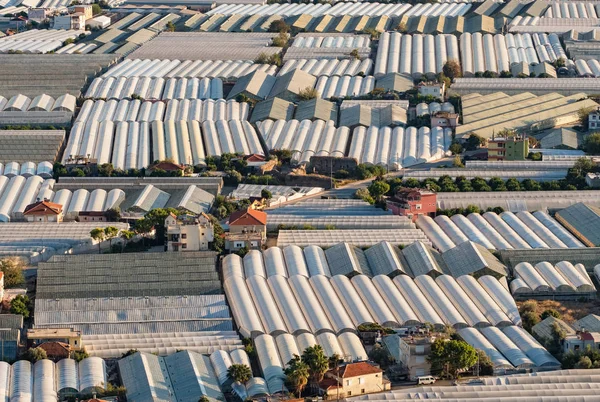 Endless greenhouses at sunset — Stock Photo, Image