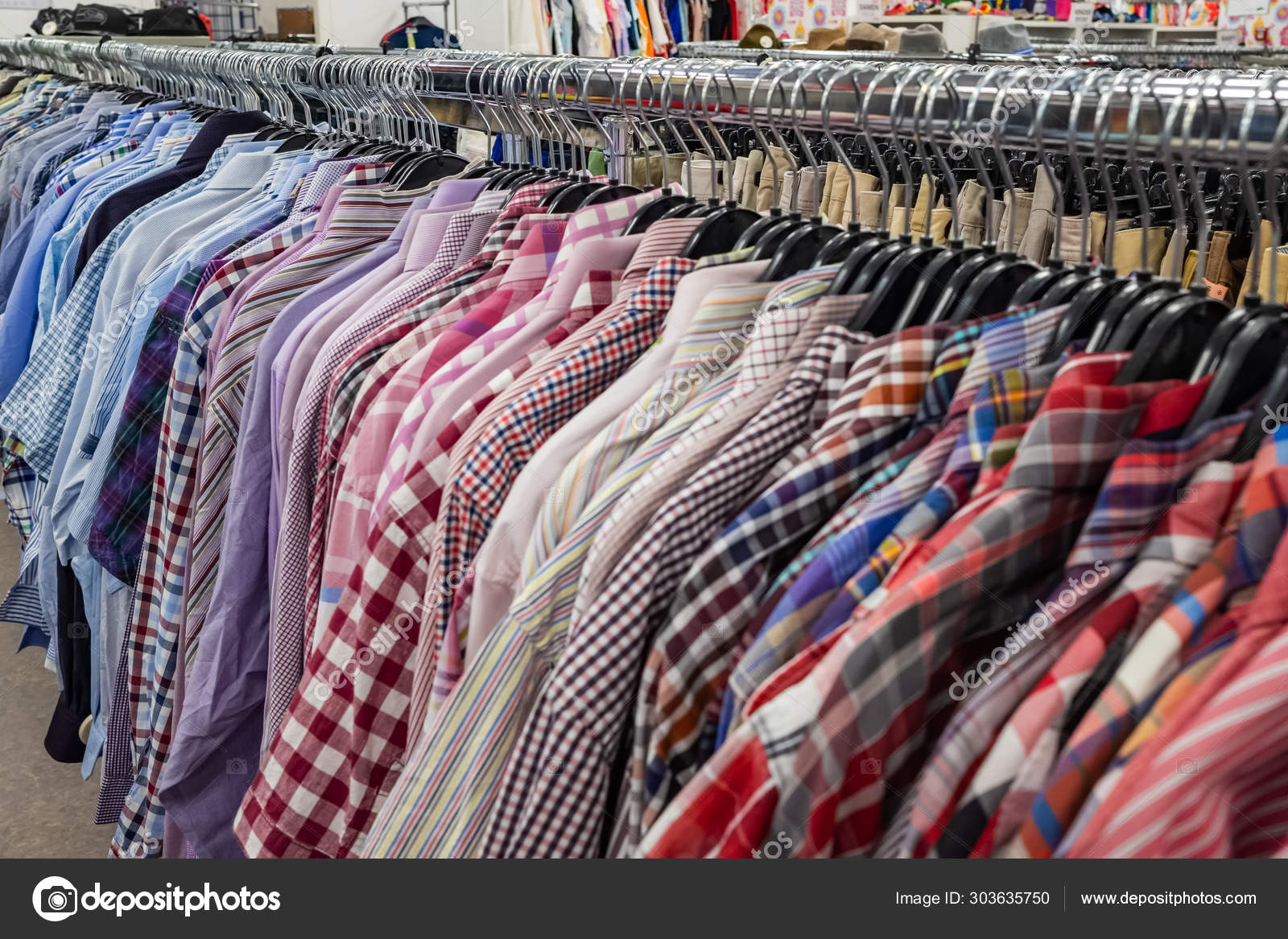 The Secondhand clothes in the market Stock Photo by ©mazzzur 303635750