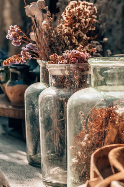 Closeup of a bouquet of dried flowers in vintage glass vase — Stock Photo, Image