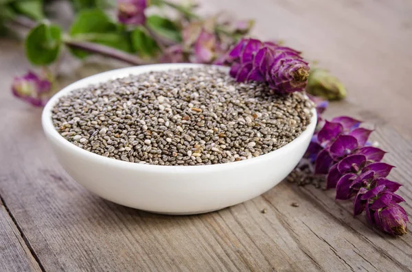 Súper Alimento Saludable Semillas Chía Tazón Con Flor Sobre Mesa — Foto de Stock