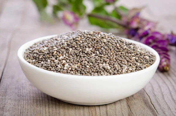 Súper Alimento Saludable Semillas Chía Tazón Con Flor Sobre Mesa —  Fotos de Stock