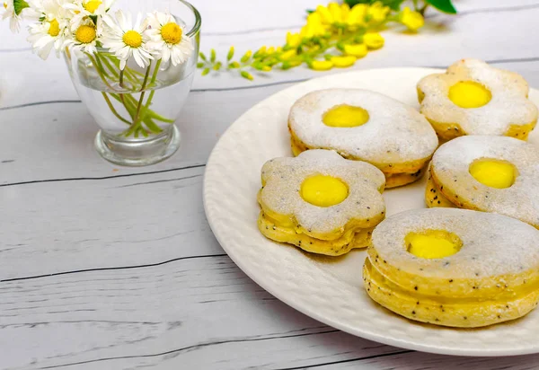 Easter biscuits like eggs with citrus cream Royalty Free Stock Photos