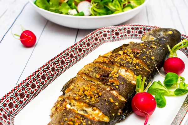 Roasted trout with vegetables walnuts and blue cheese — Stock Photo, Image