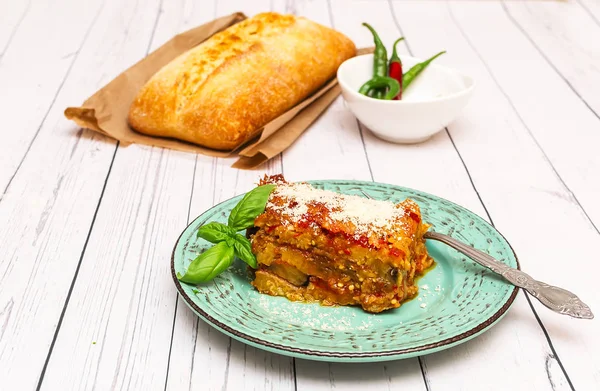 Eggplant with parmesan in a plate traditional Italian recipe — Stock Photo, Image