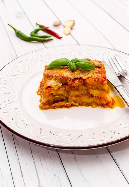 Eggplant with parmesan in a plate traditional Italian recipe — Stock Photo, Image