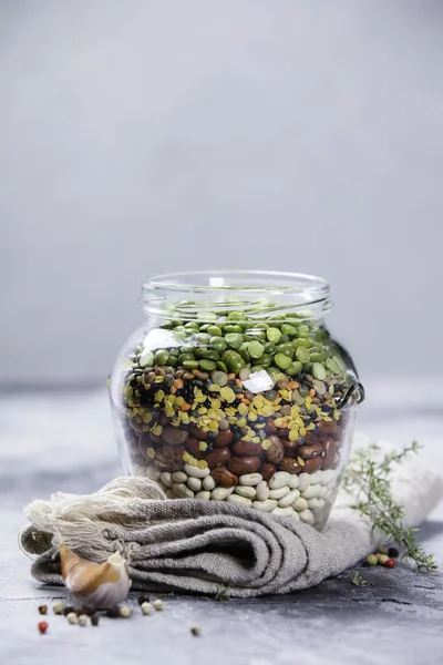 Legumes - lentils chickpeas beans and green peas — Stock Photo, Image