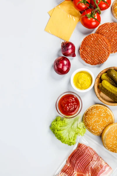 Homemade hamburgers, flat lay — Stock Photo, Image