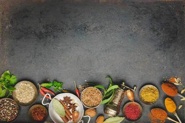 Herbs and spices on dark background — Stock Photo, Image