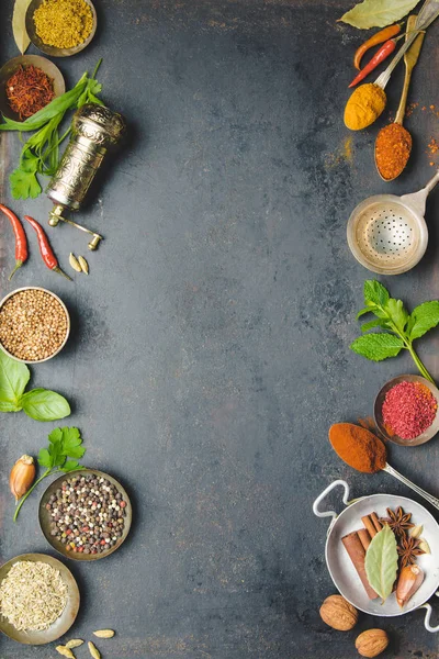 Herbs and spices on dark background — Stock Photo, Image